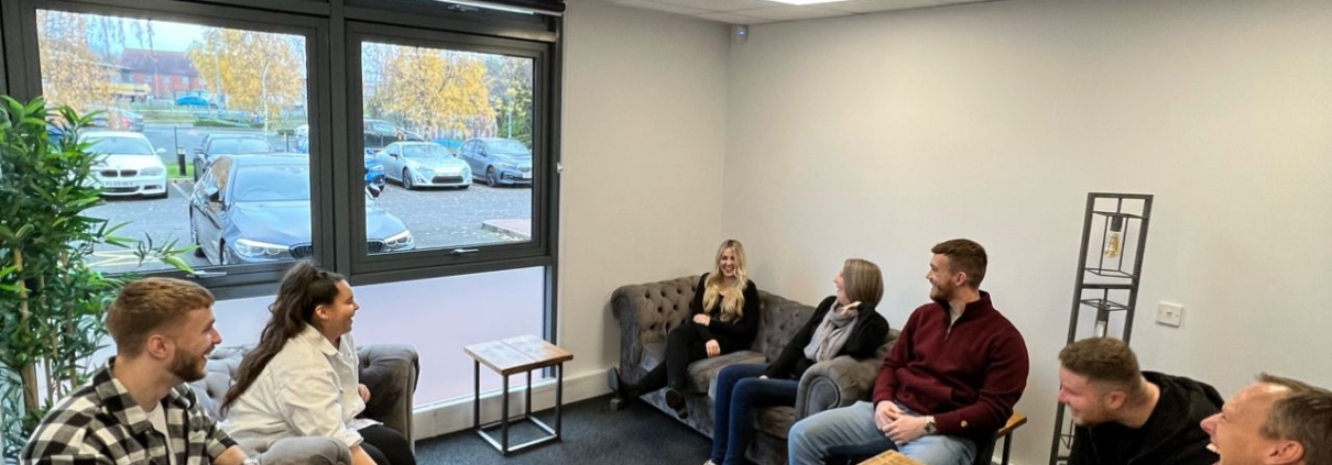 This is a picture of the ChadStone team all laughing together in a meeting