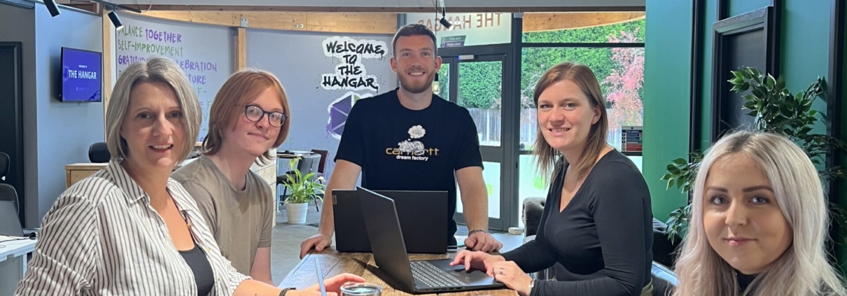 This is a picture of the team looking happy because they have followed these wellbeing and finance hacks and they are helping our clients do the same
