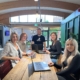 This is a picture of the team looking happy because they have followed these wellbeing and finance hacks and they are helping our clients do the same