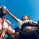 This is a picture of a business owner navigating the summer holidays with their child, using the 7 tips in this post