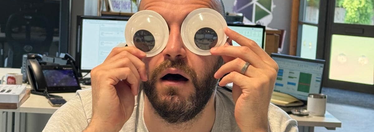 This is a picture of one of the ChadStone directors with googly eyes in front of his computer screen to show overwhelm at work, which is exactly why you need this blog - Spring Planning Mode: How to Hit Your Q2 Goals Without the Overwhelm