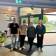 This is four members of the ChadStone team smiling behind their desks to show beating the post-January slump with simple, practical ways to stay productive without burning out. A calm week checklist for business owners to protect energy, prioritise and stay on track.